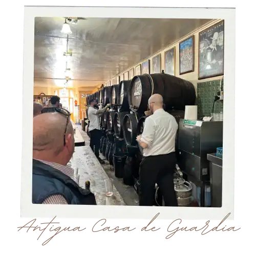 Inside Antigua Casa de Guardia the oldest bar in Malaga with barrels and wooden counter