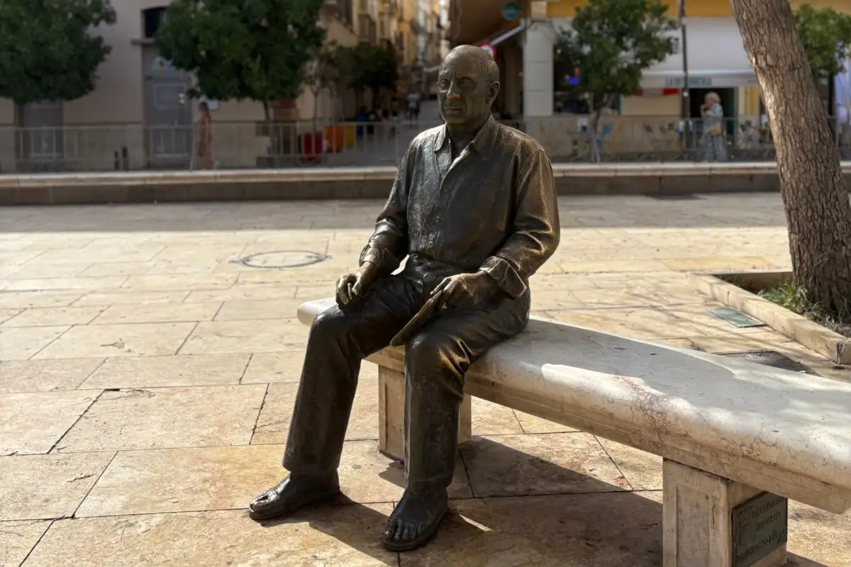 Picasso statue on a bench at Plaza de la Merced in Malaga