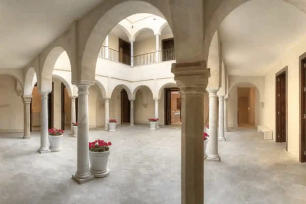 A flower-filled arched courtyard patio in Málaga