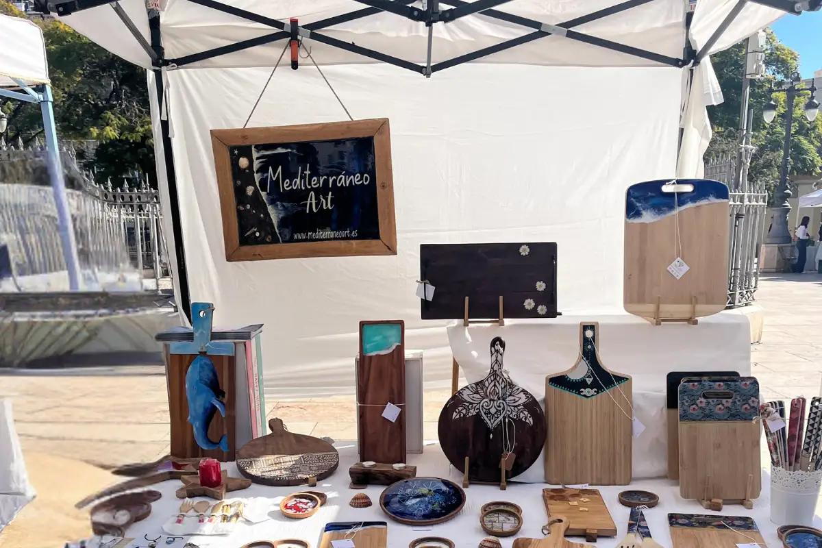 Handmade craft stall at the Mercado Artesanal La Merced in Plaza de la Merced, Malaga