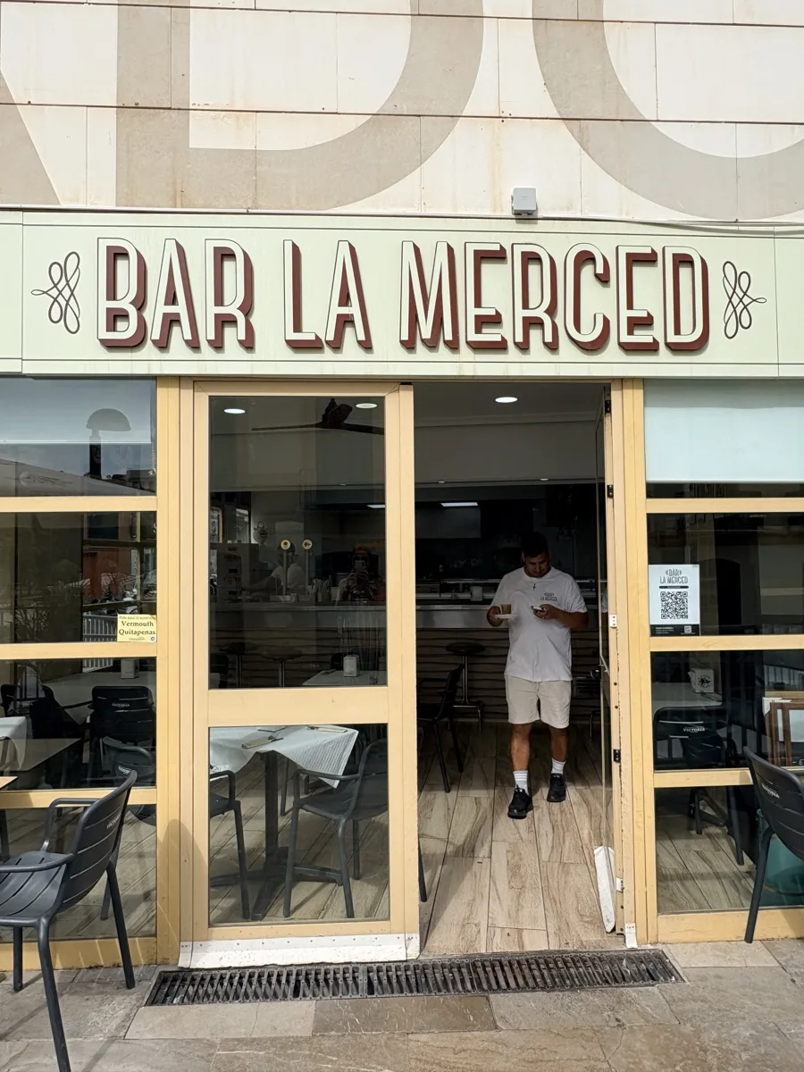 The Bar La Merced sign above the entrance in Málaga