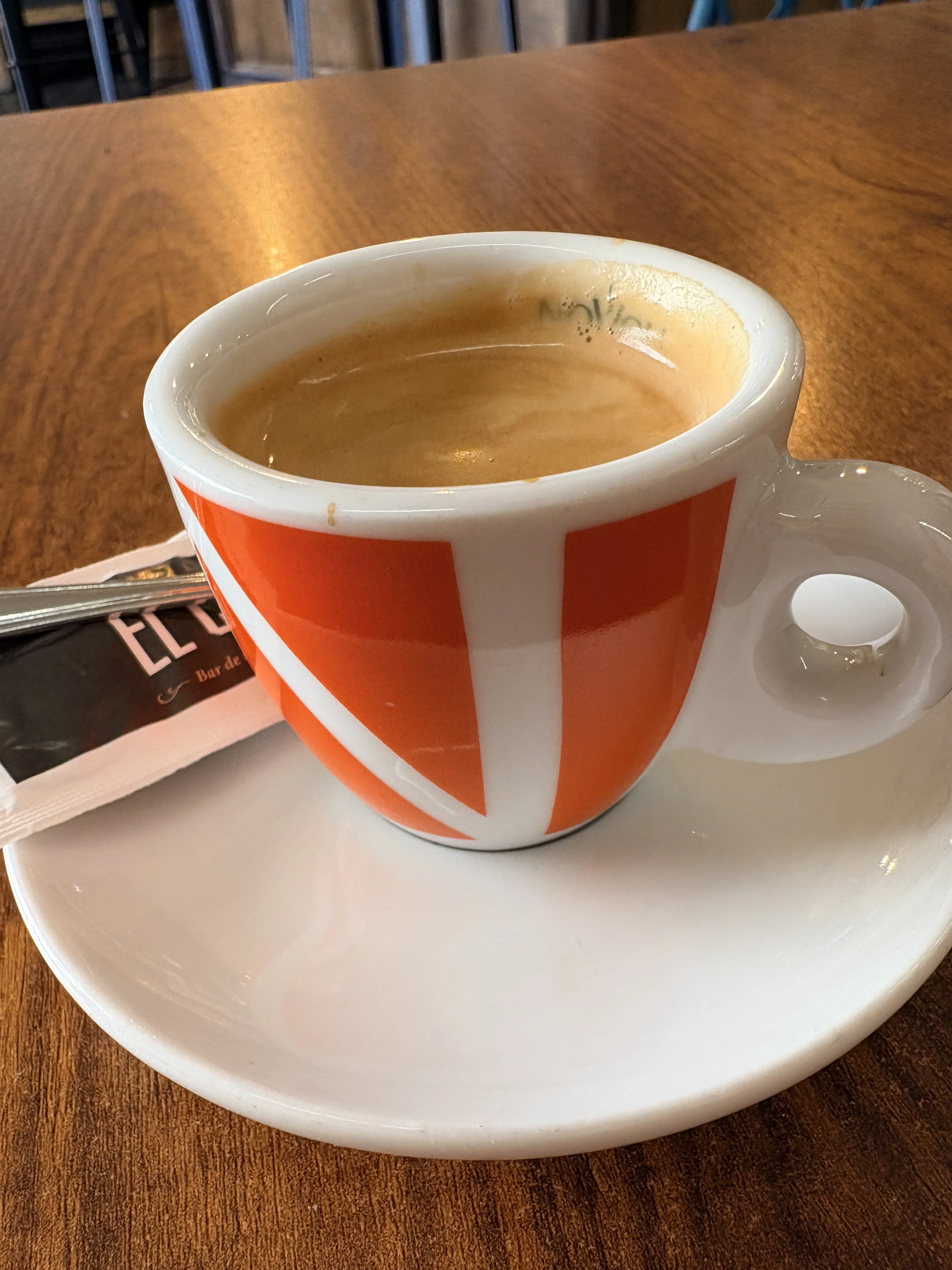 A strong black coffee in a small cup at a bar in Málaga