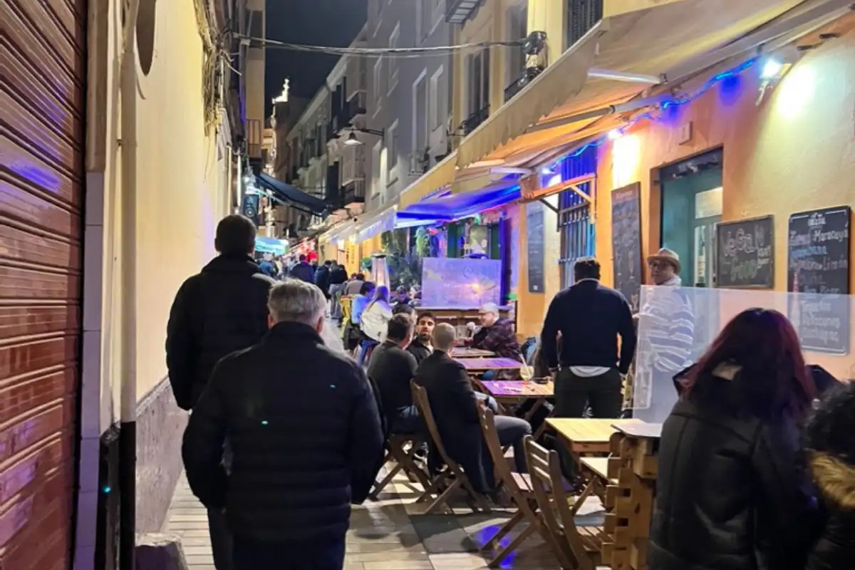 Busy tourist restaurant terrace near Malaga Cathedral on Calle Larios