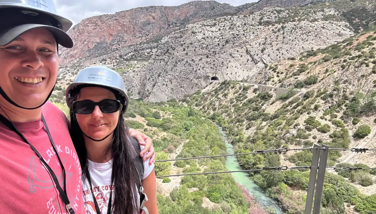 A man and a woman posing for a picture at the Caminito del Rey in Malaga.