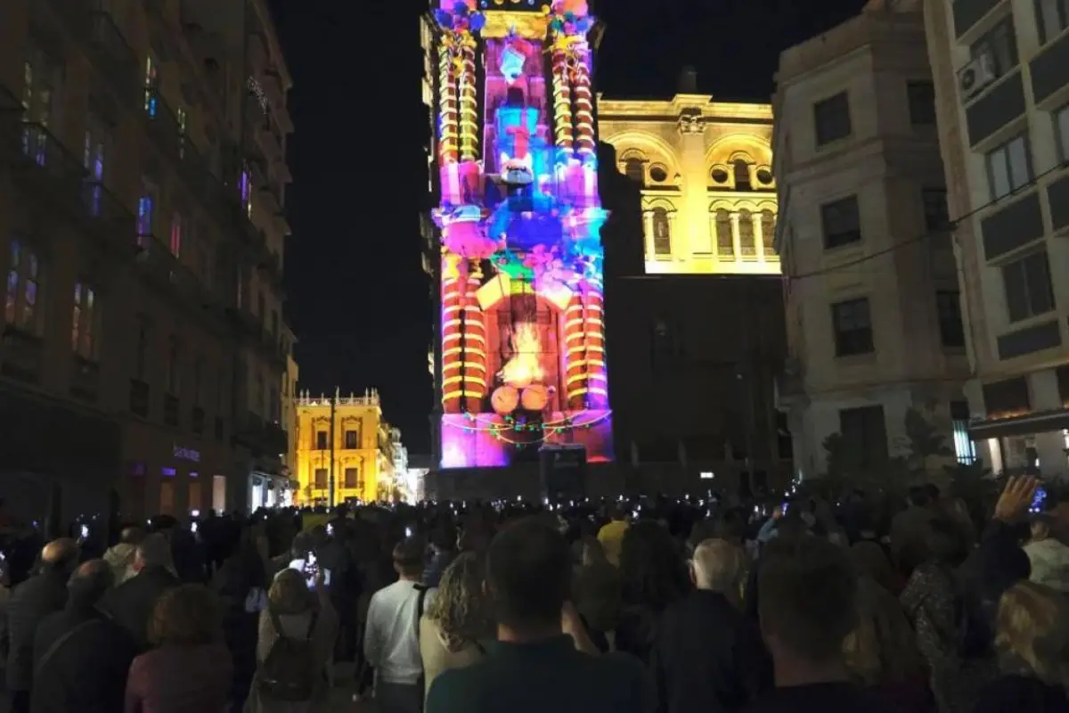 Crowds watching the Christmas video-mapping light show on Malaga Cathedral