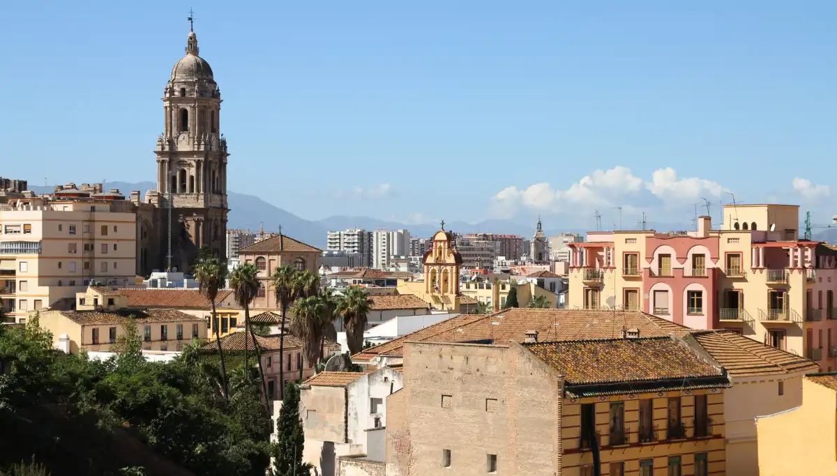 Málaga city waterfront with the Alcazaba fortress on the hillside