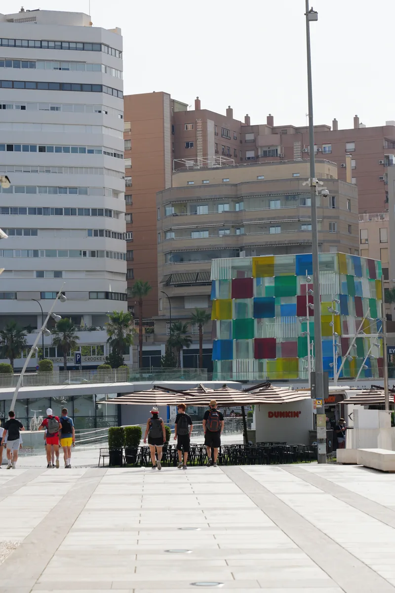 The multicoloured glass cube of the Centre Pompidou on Muelle Uno in Málaga, with the walkway in front