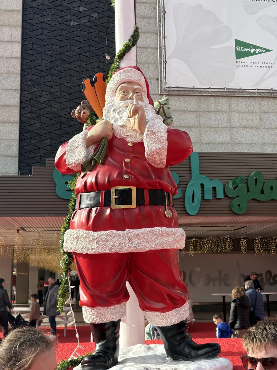 Giant Santa Claus statue outside the El Corte Ingles storefront in Malaga at Christmas