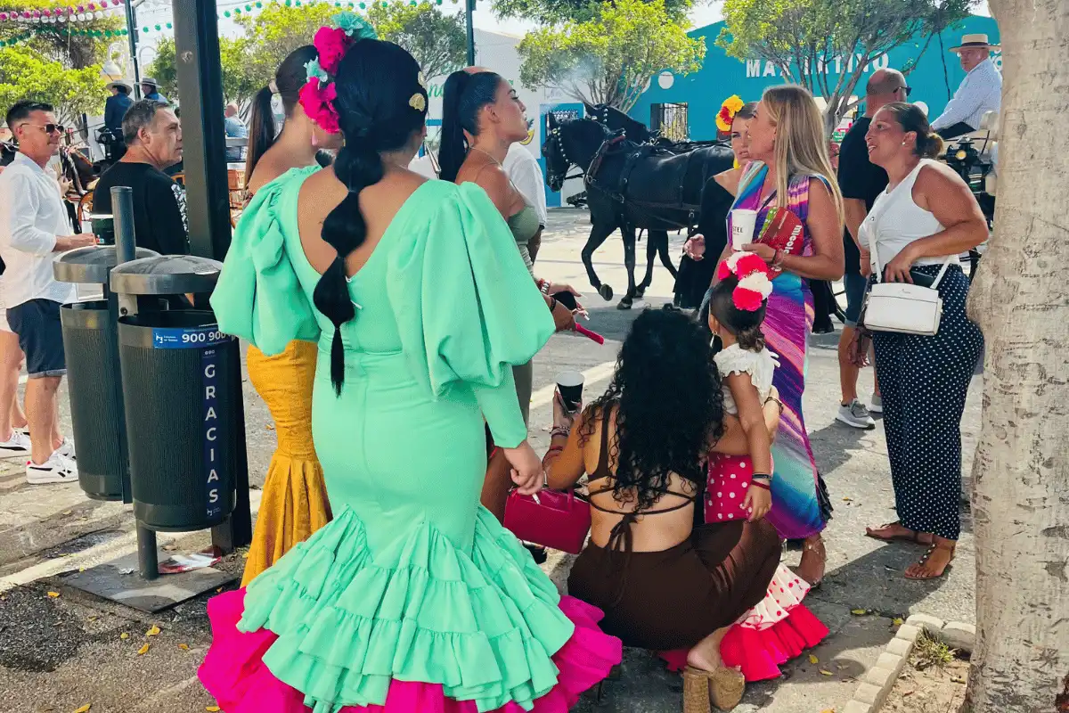 Crowd in flamenco dresses at an Andalusian feria
