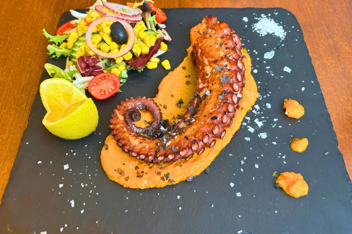 Charred octopus leg on sweet potato puree at Picasso Bar Málaga