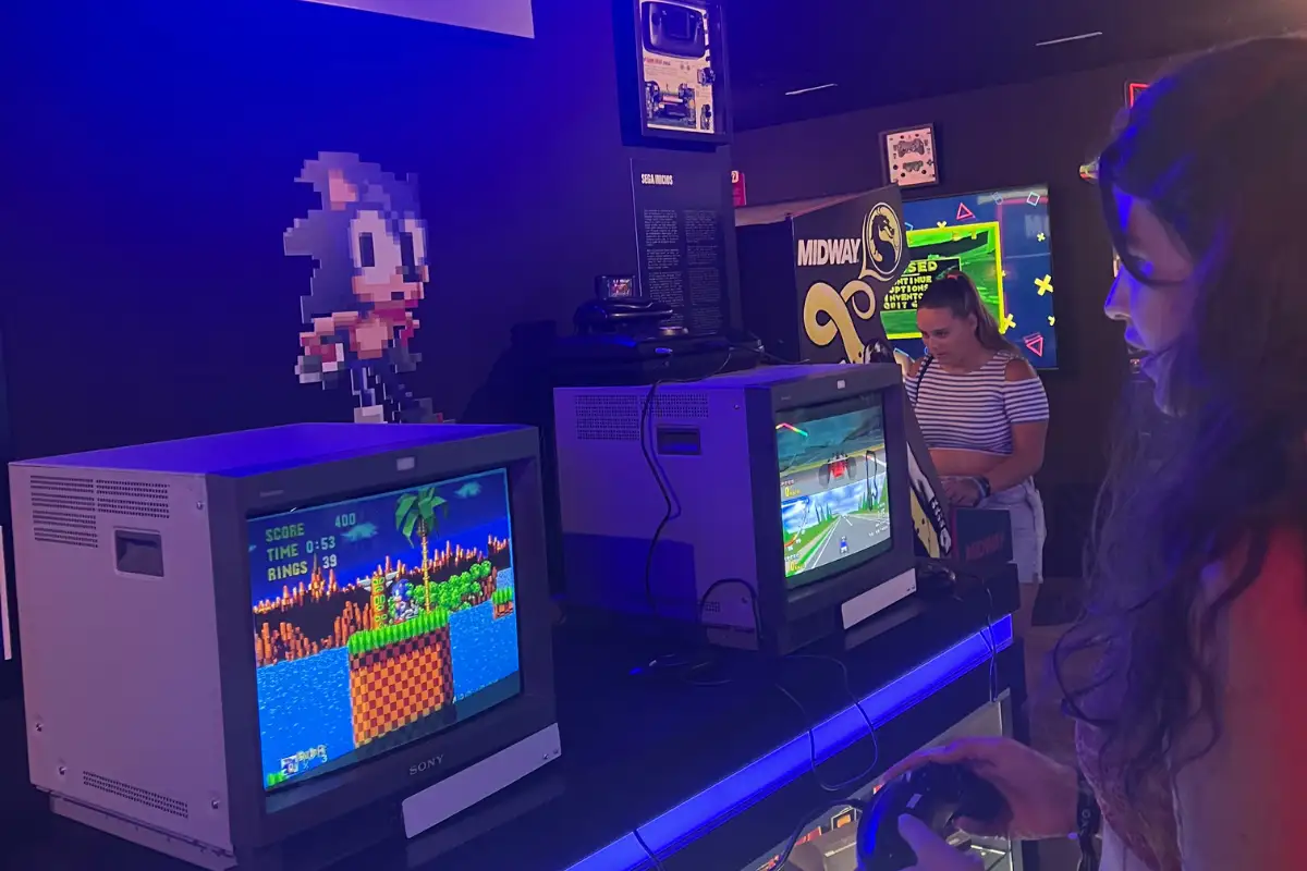 Heidi playing Sonic on a retro console inside the OXO Video Game Museum in Málaga