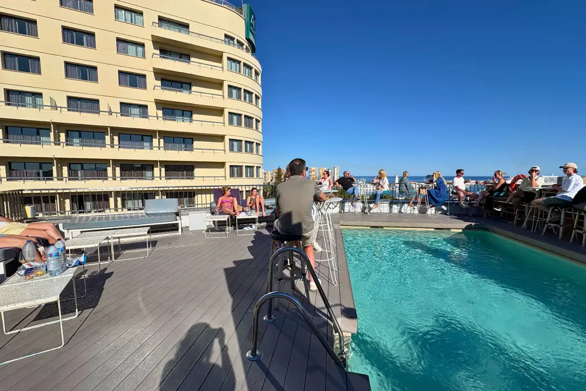 Rooftop pool terrace at Hotel Molina Lario overlooking Málaga Cathedral and the coast