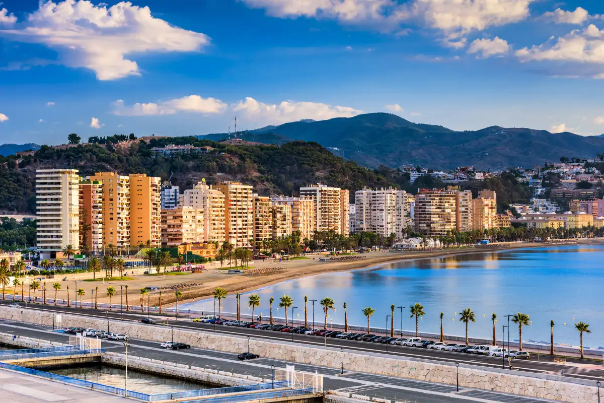 Málaga city beach and seafront apartment buildings on a clear winter day