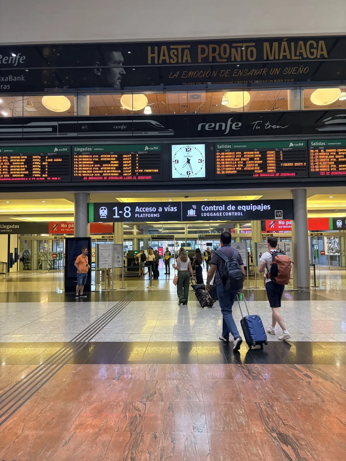 The departures board inside Málaga María Zambrano station, listing trains to Córdoba, Sevilla, Granada and beyond