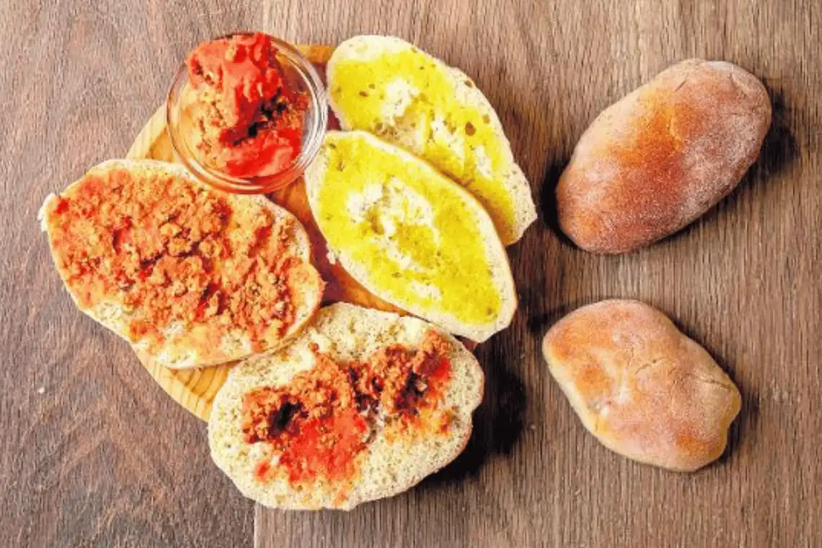 Molletes, the traditional Málaga breakfast of toasted bread with tomato and olive oil