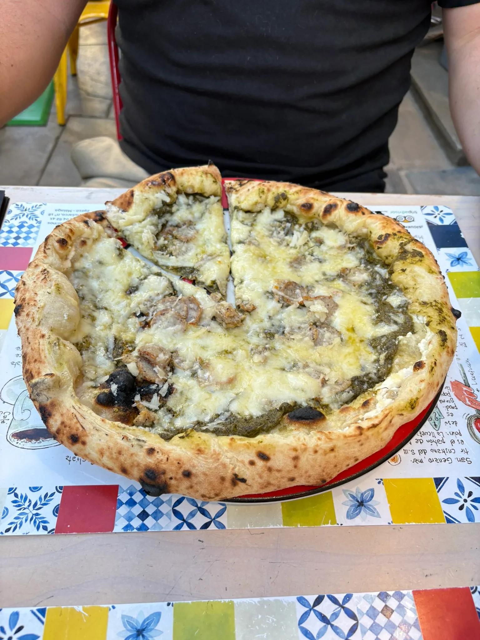 Neapolitan pizza with pesto, sausage and fresh basil at Terra Mia Málaga