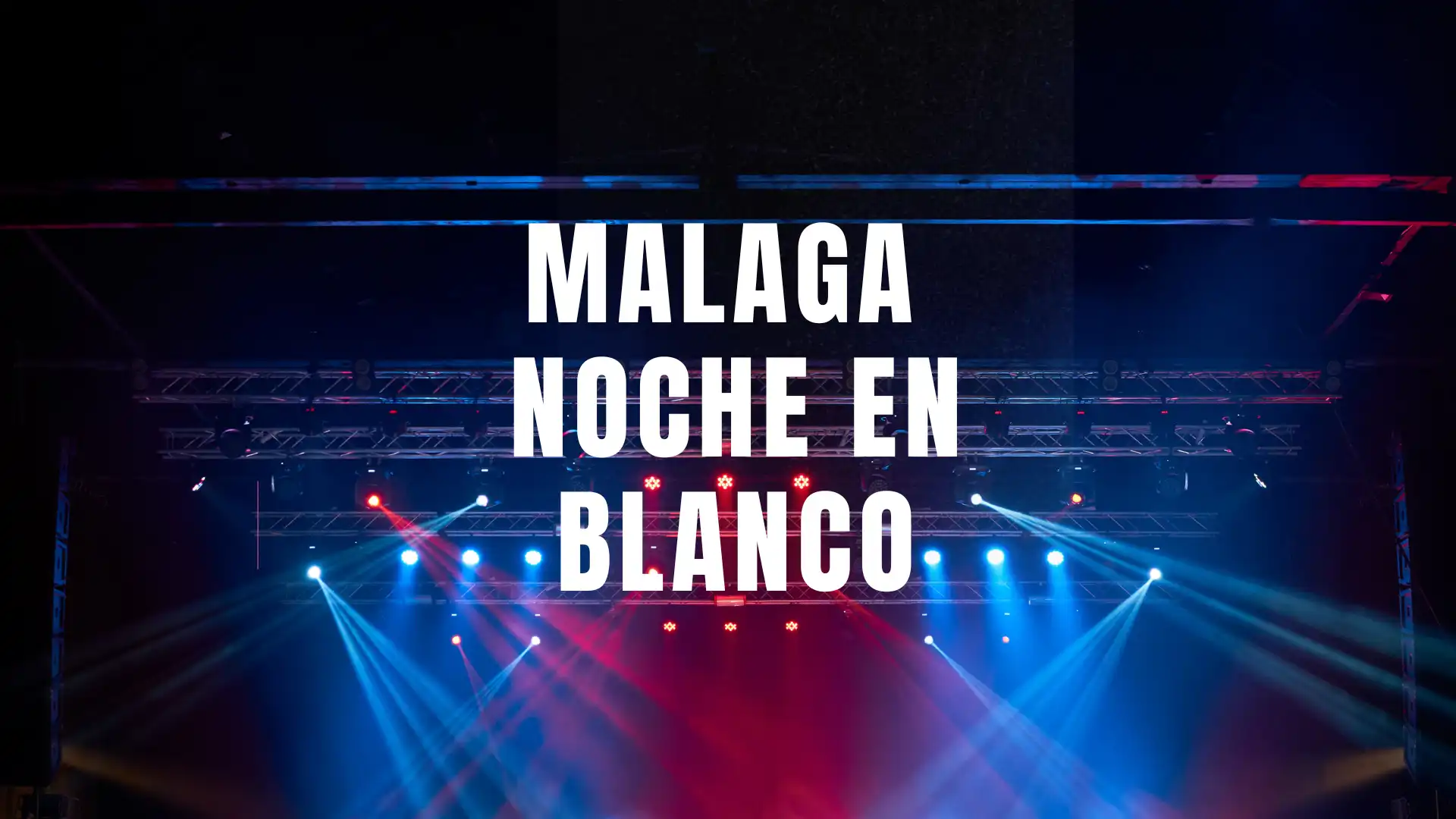 Stage lights over a night crowd during Noche en Blanco in Málaga
