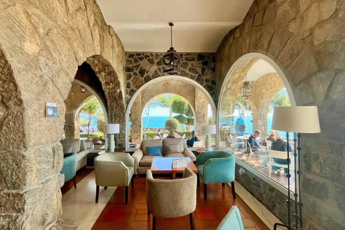 Stone arched terrace lounge at the Parador de Málaga Gibralfaro with sea views