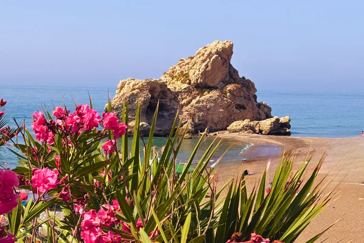 Local families on the sand at Playa Peñón del Cuervo, Málaga