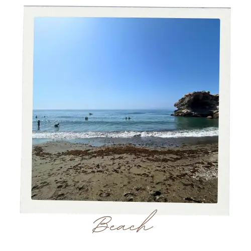 The distinctive crow's rock formation rising from the sea at Peñón del Cuervo beach