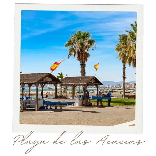 Wide sandy beach in Malaga with calm blue Mediterranean water