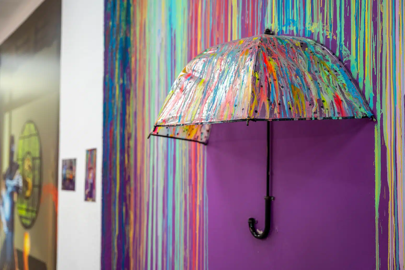Paint-splattered umbrella art installation inside the Centre Pompidou Málaga