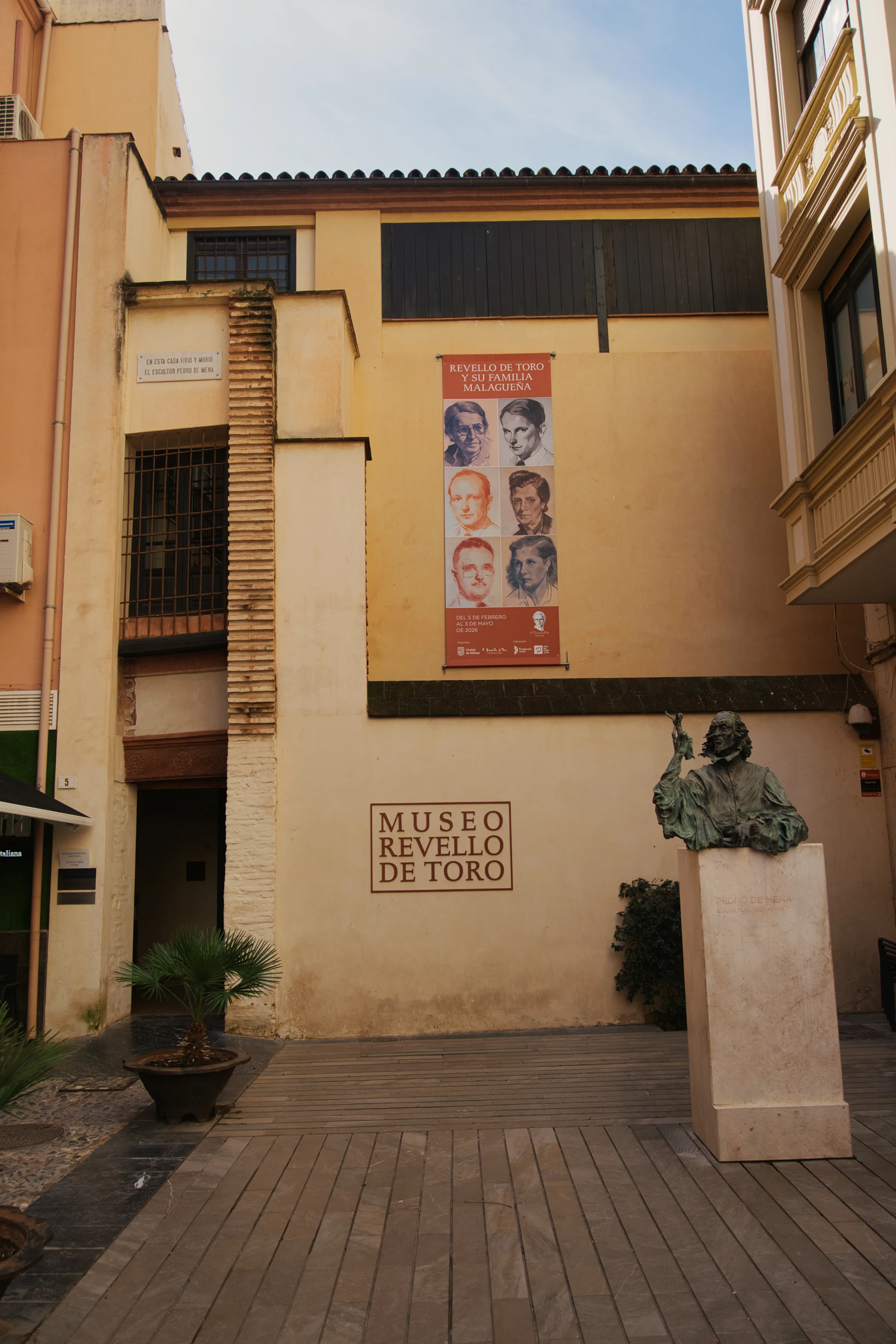 The entrance to the Félix Revello de Toro Museum in Malaga, with a bronze bust of the artist outside