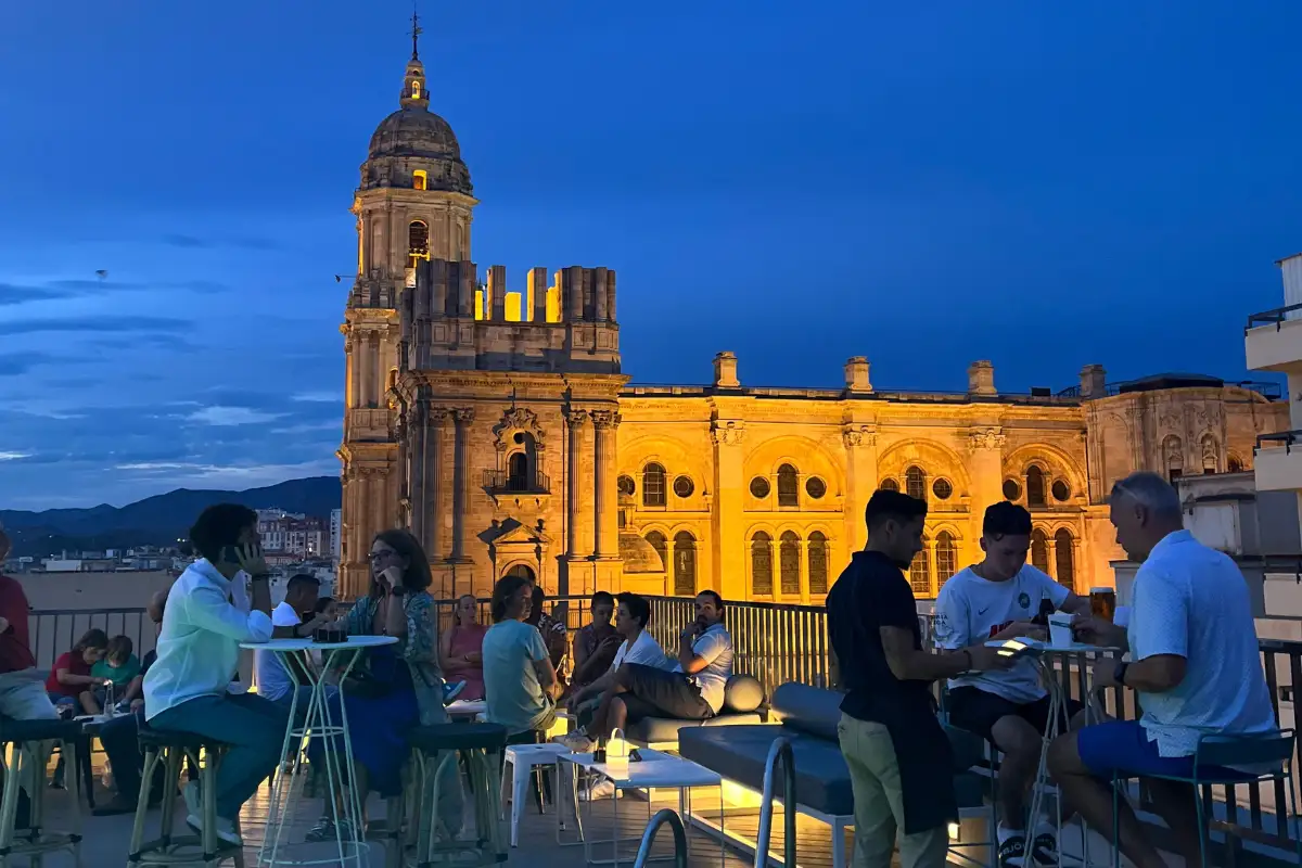 Sunset view over Malaga from a rooftop bar terrace