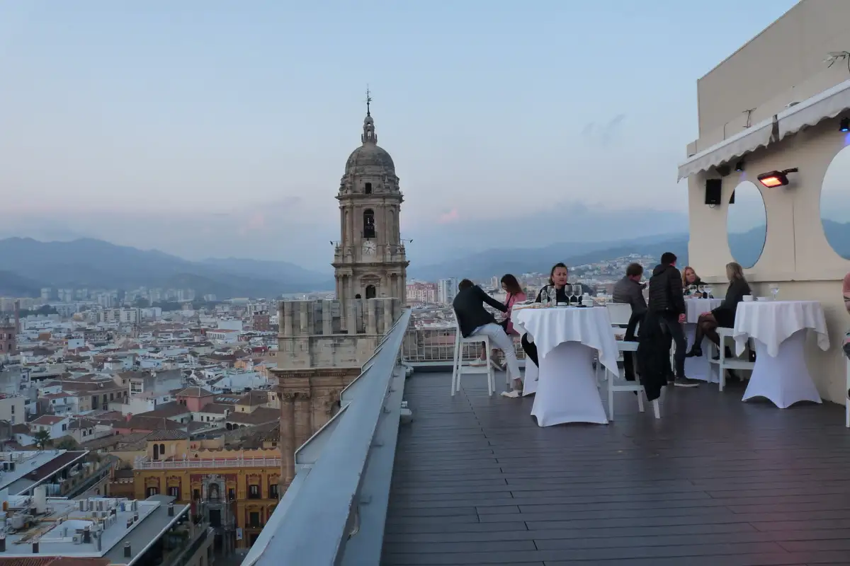 Rooftop view over Malaga's terracotta rooftops with the Cathedral tower in the distance