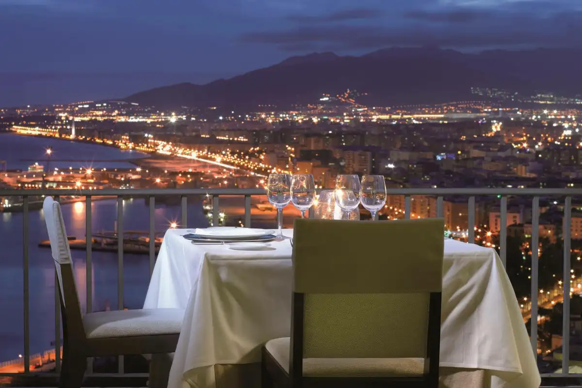Panoramic rooftop terrace at Parador de Málaga Gibralfaro overlooking city and harbour