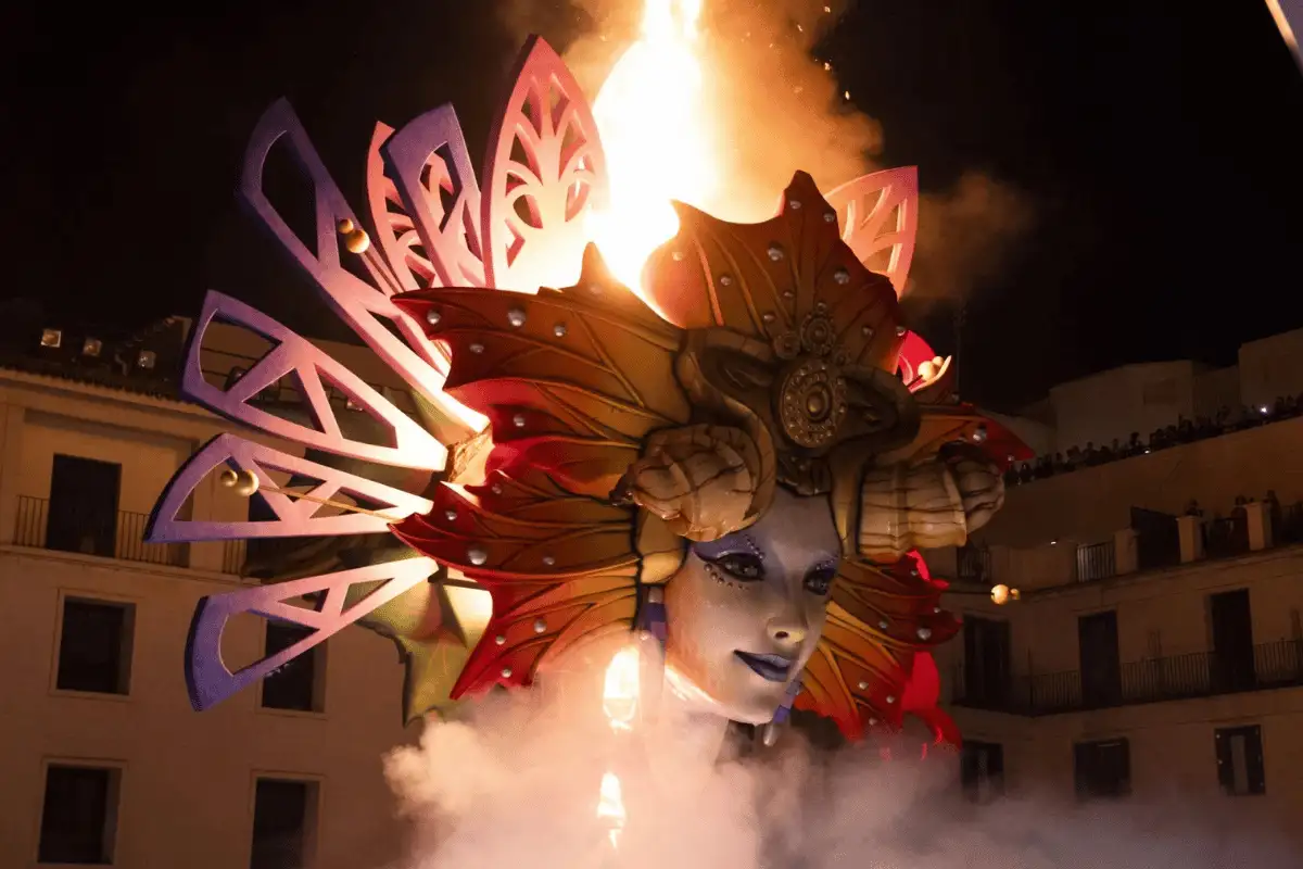 Crowds gathered around bonfire sculptures at Hogueras de San Juan in Alicante