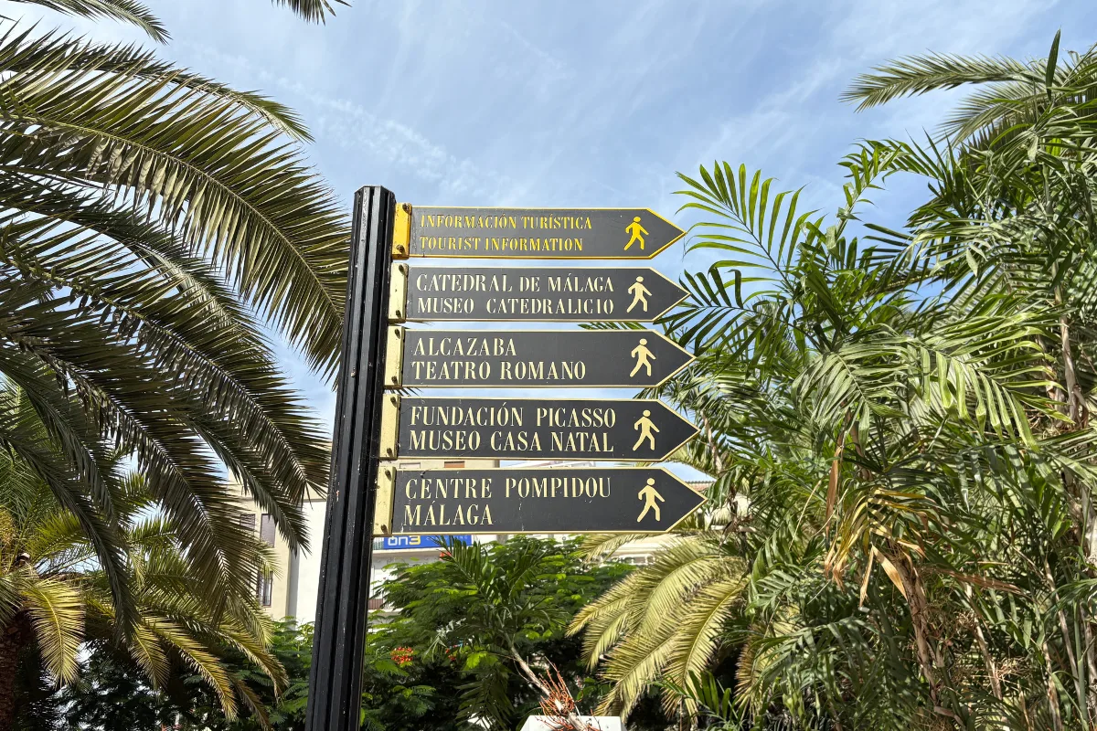 Tourist signpost in Málaga pointing towards the Cathedral, Alcazaba, Teatro Romano, Picasso Foundation and Centre Pompidou