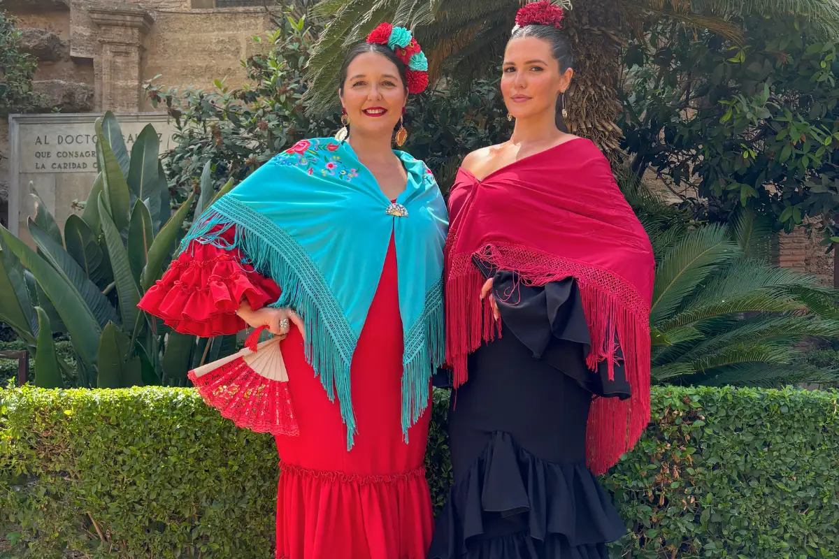 Flamenco dress displayed with accessories including fan and shawl