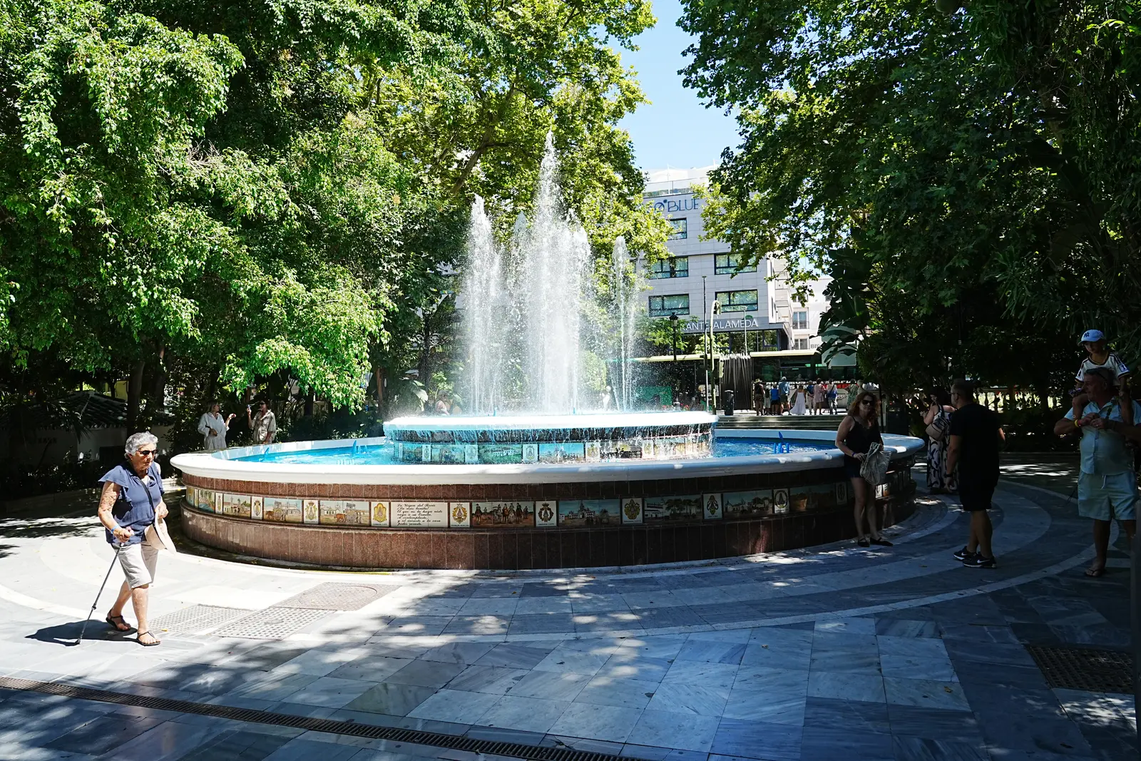 Tiled fountain and shaded paths in Parque de la Alameda, Marbella