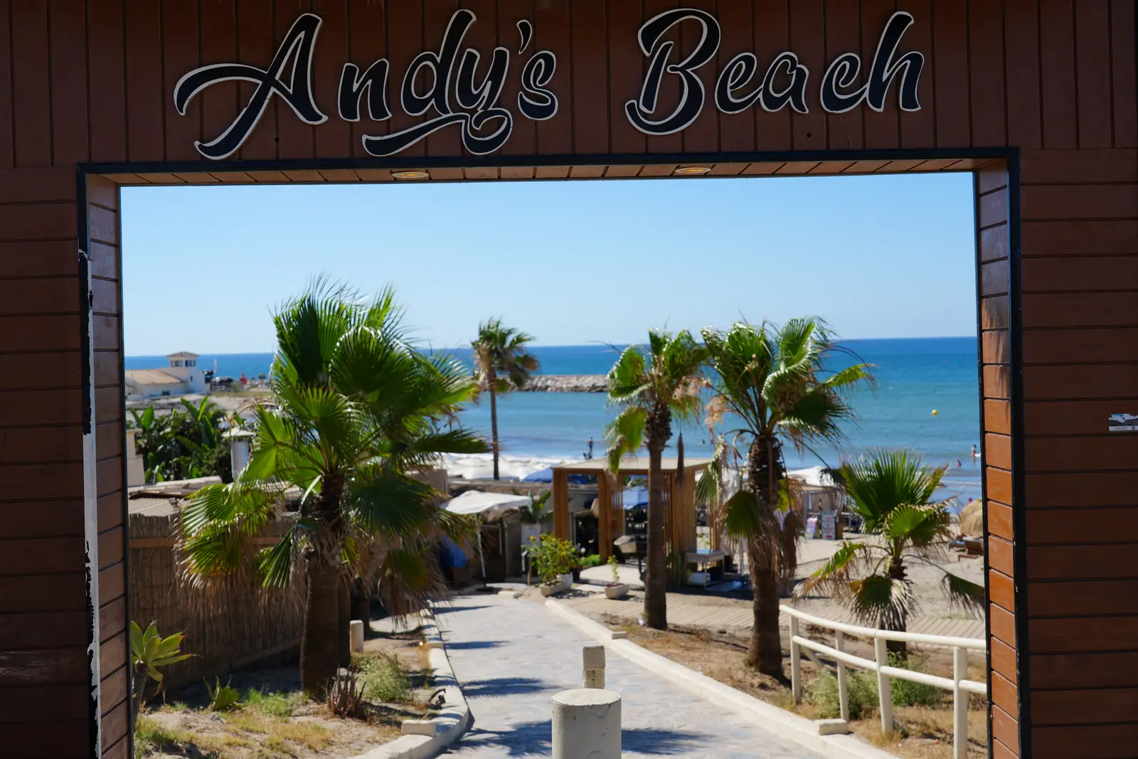 Andy's Beach sign archway on the Marbella seafront