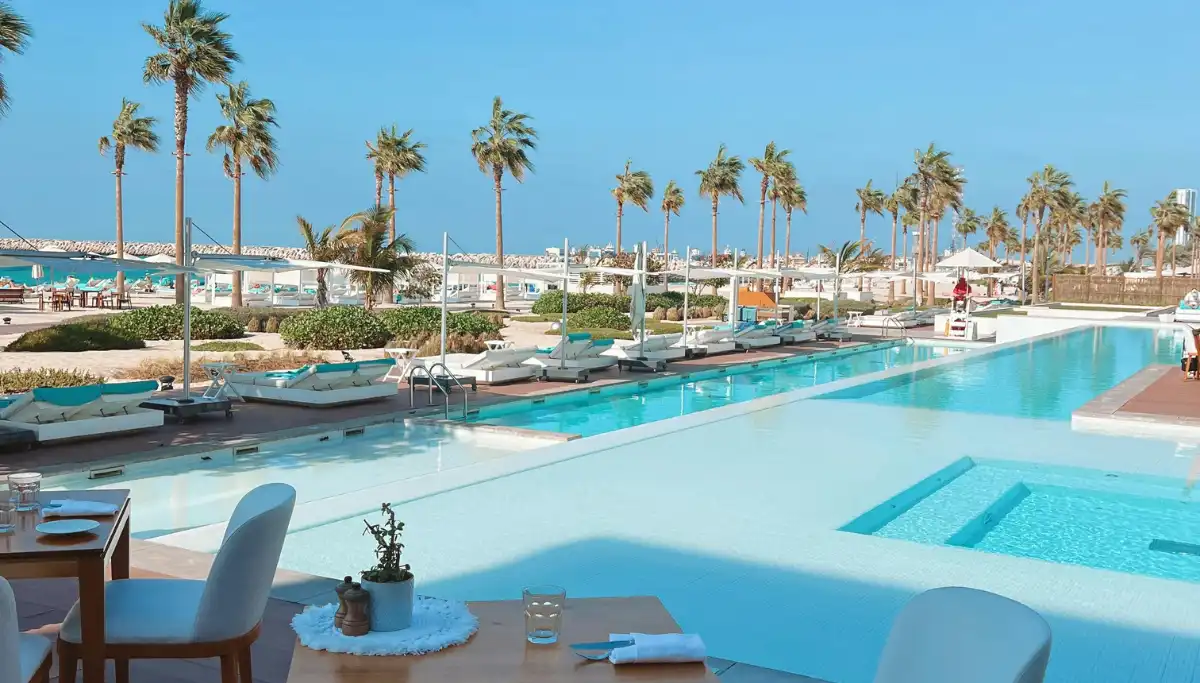 Nikki Beach Marbella at sunset with sun loungers facing the Mediterranean