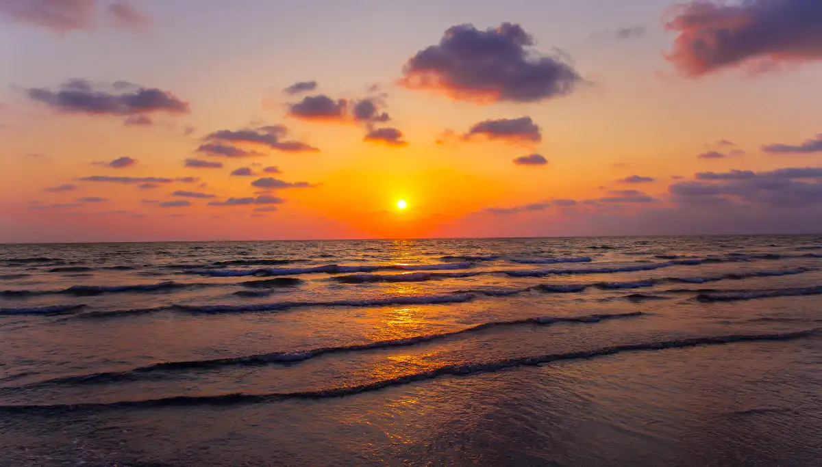 Sunset light over Playa Venus beach near Marbella Old Town