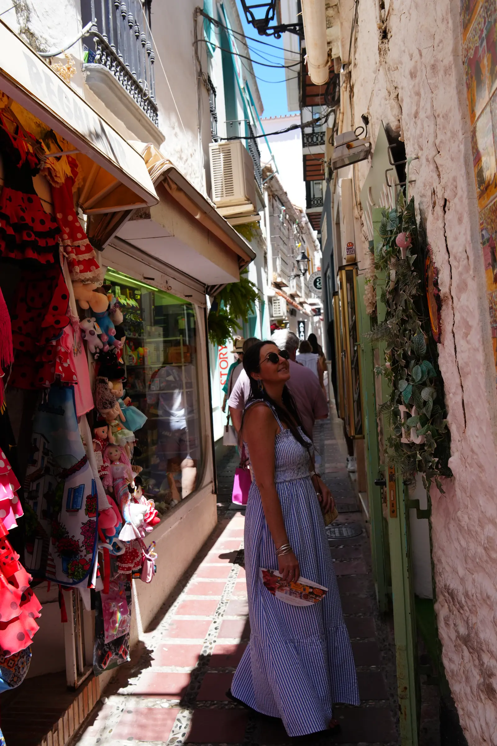 Heidi walking through a very narrow street in Marbella Old Town