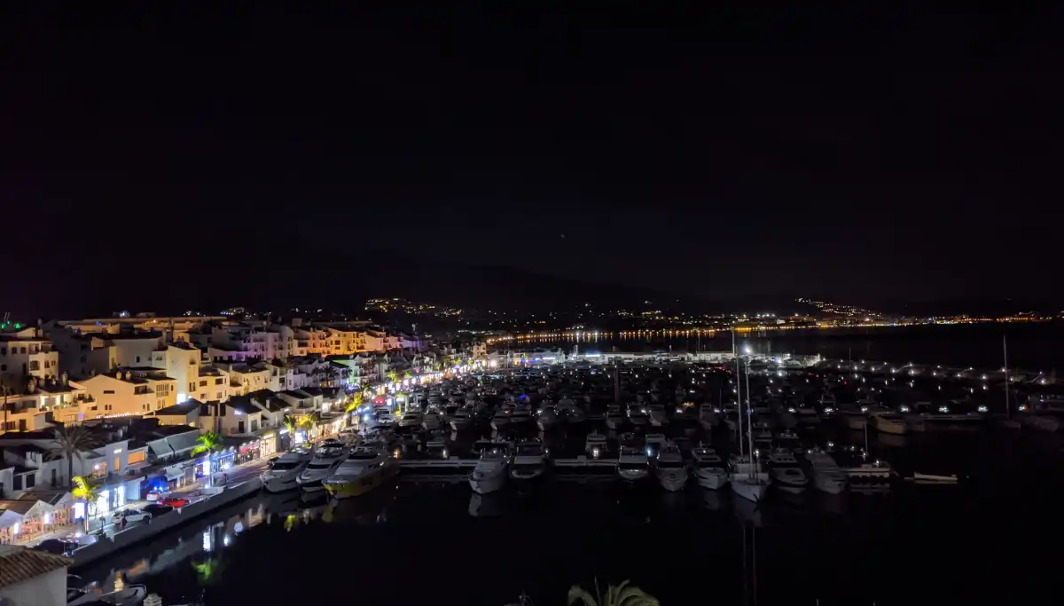 Puerto Banús marina lit up at night in Marbella