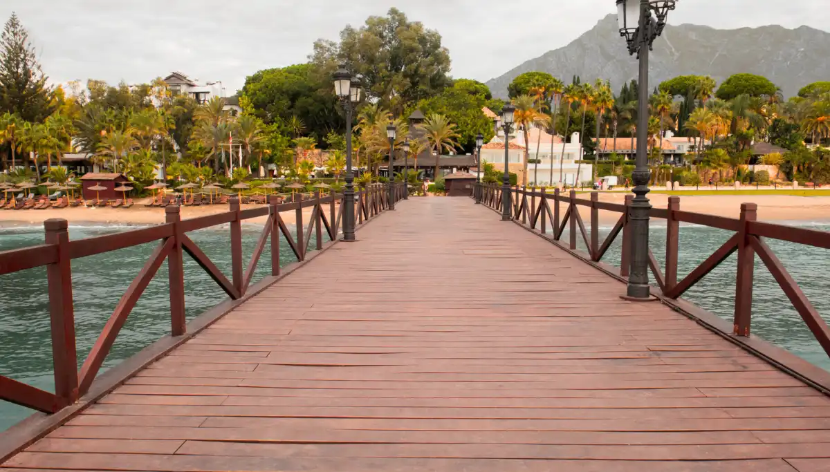 Wooden pier at the Embarcadero near Marbella Club Hotel at golden hour