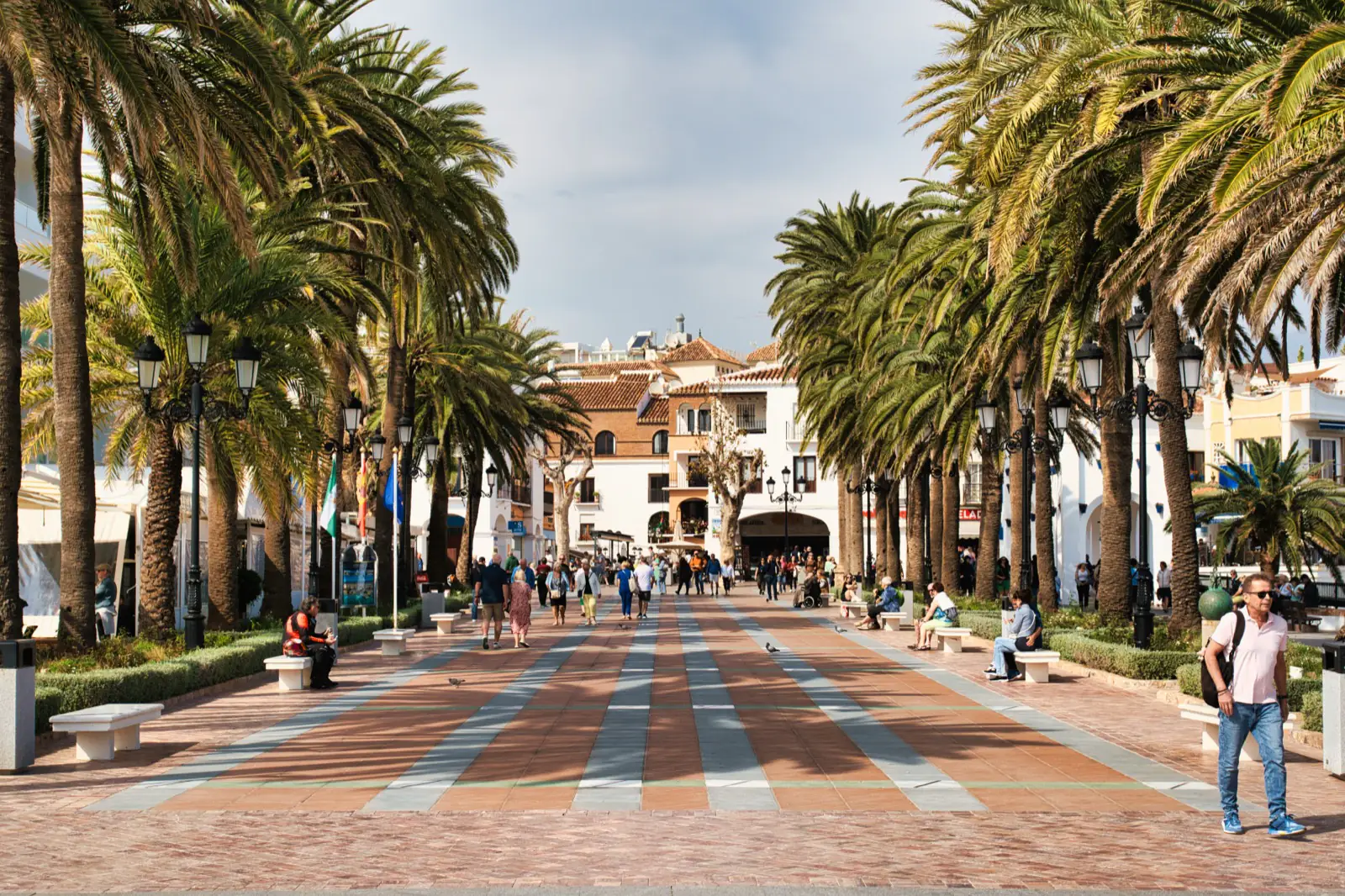 People walking along the Balcón de Europa promenade in Nerja