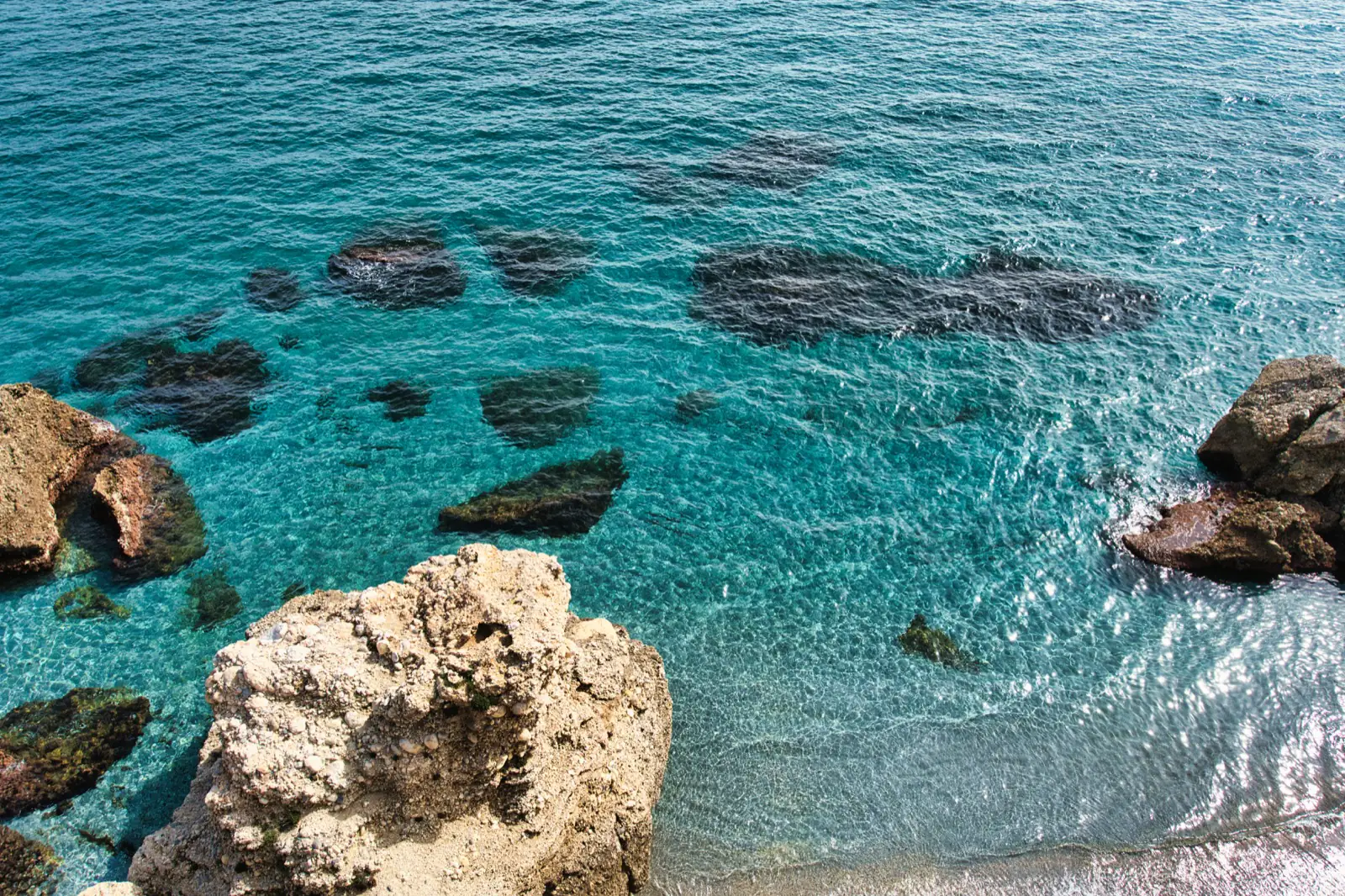 Panoramic view from the Balcón de Europa over rocky coastline and sea, Nerja
