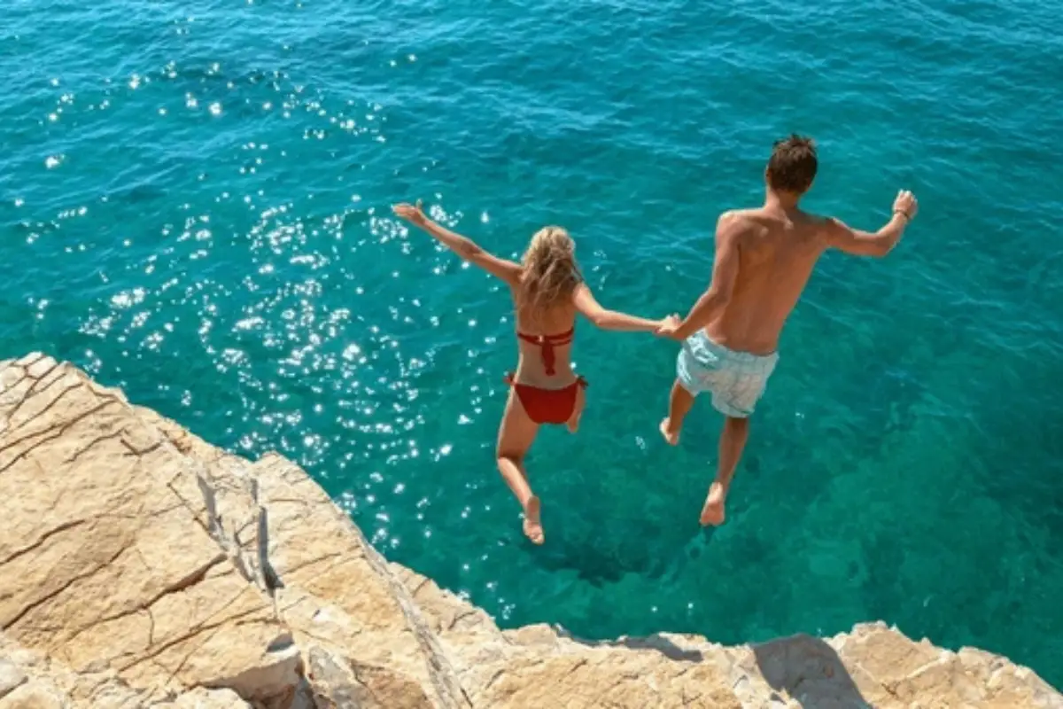 Rocky ledge at Playa Chica in Nerja, a spot known for cliff jumping