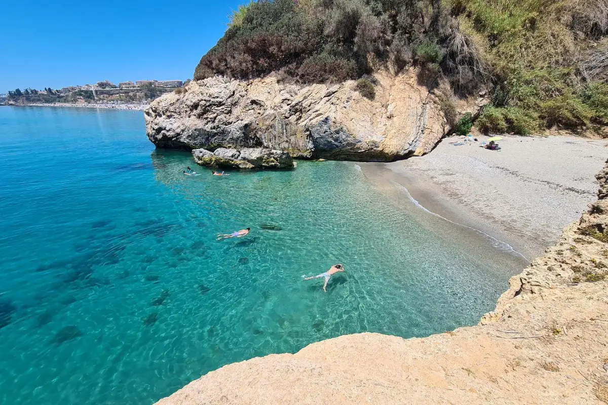 A small hidden cove near Nerja Old Town with clear water