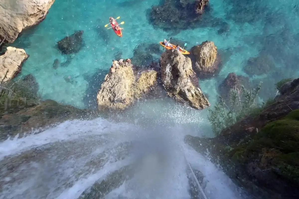 Kayakers paddling from Playa Burriana toward the Maro waterfall, Nerja