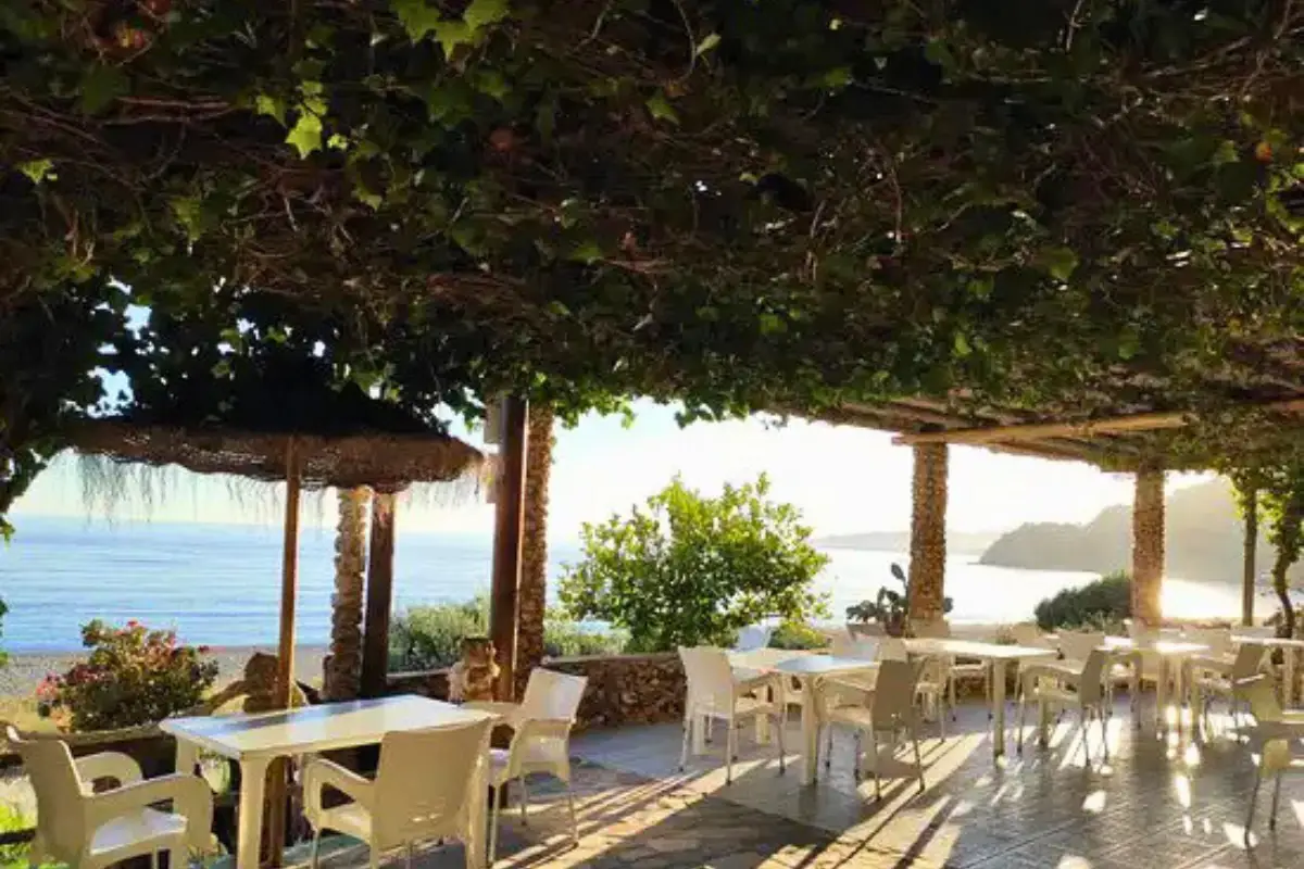Chiringuito beach bar on Playa Burriana with tables on the sand