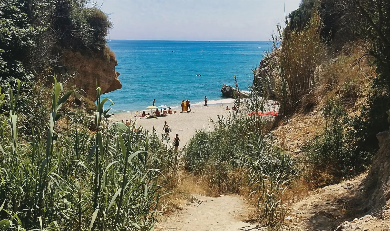 Chica Beach, a secluded rocky cove east of Playa Burriana, Nerja