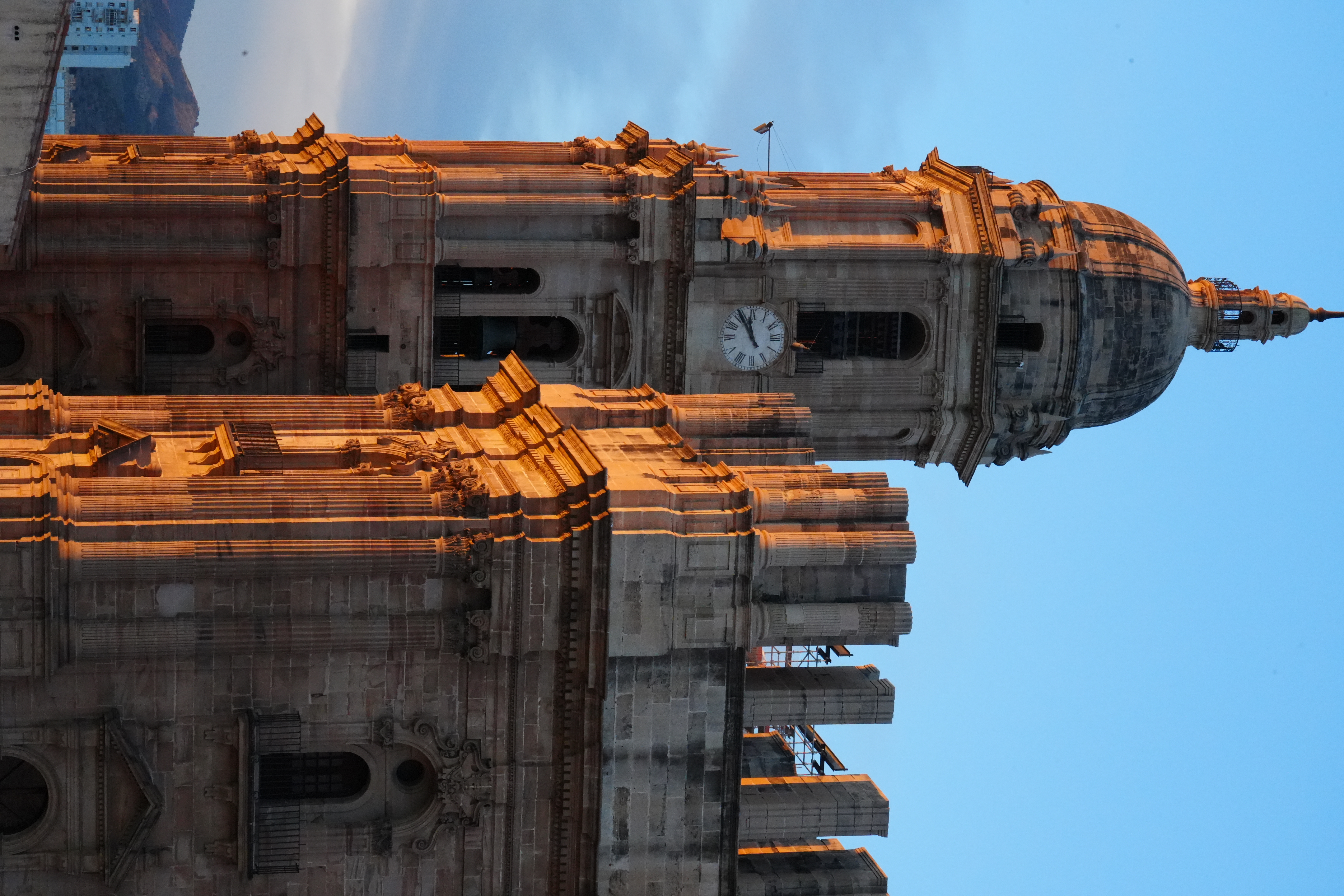 Malaga Cathedral's tower lit gold at sunset