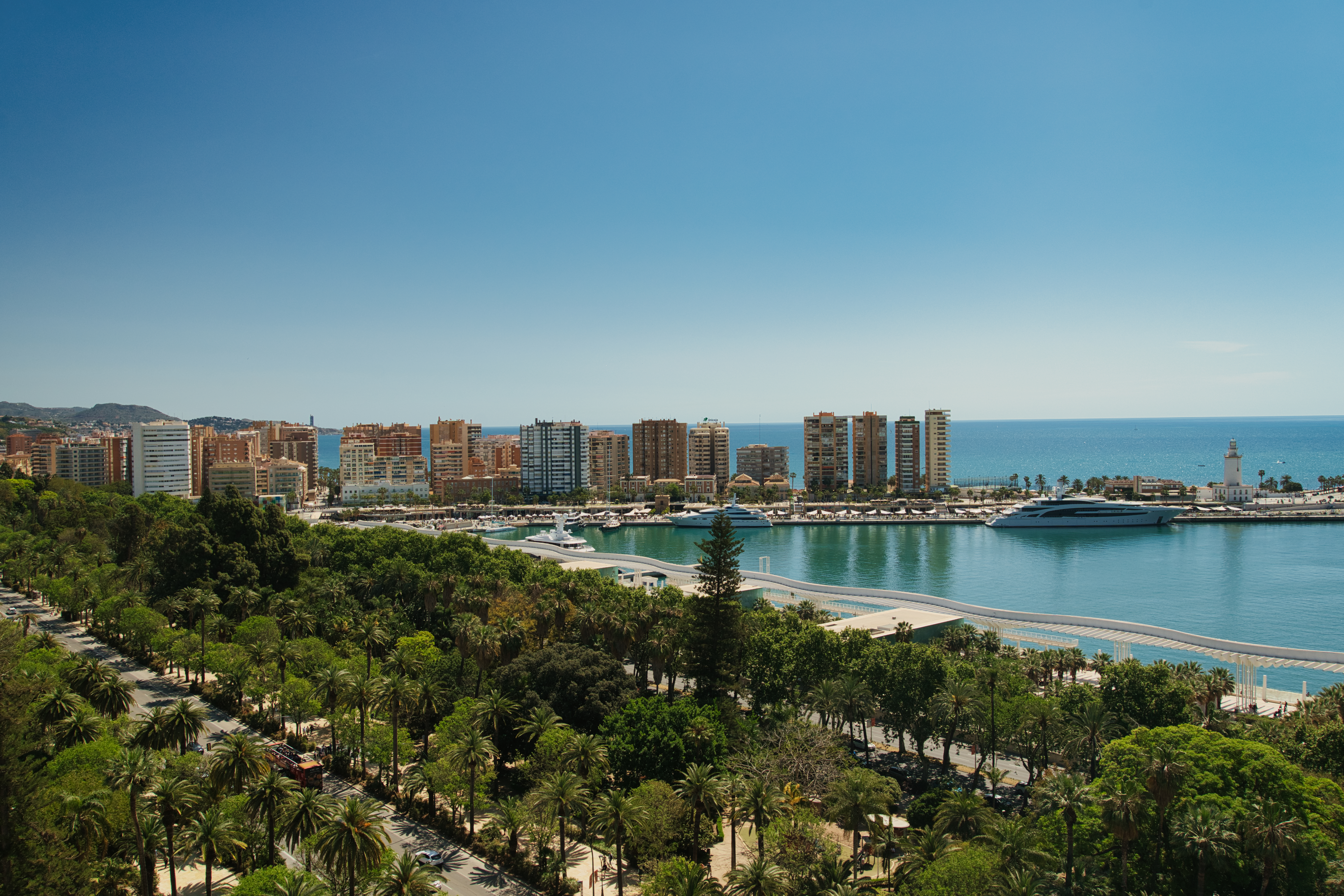 Aerial view over Malaga's port, skyline and Paseo del Parque