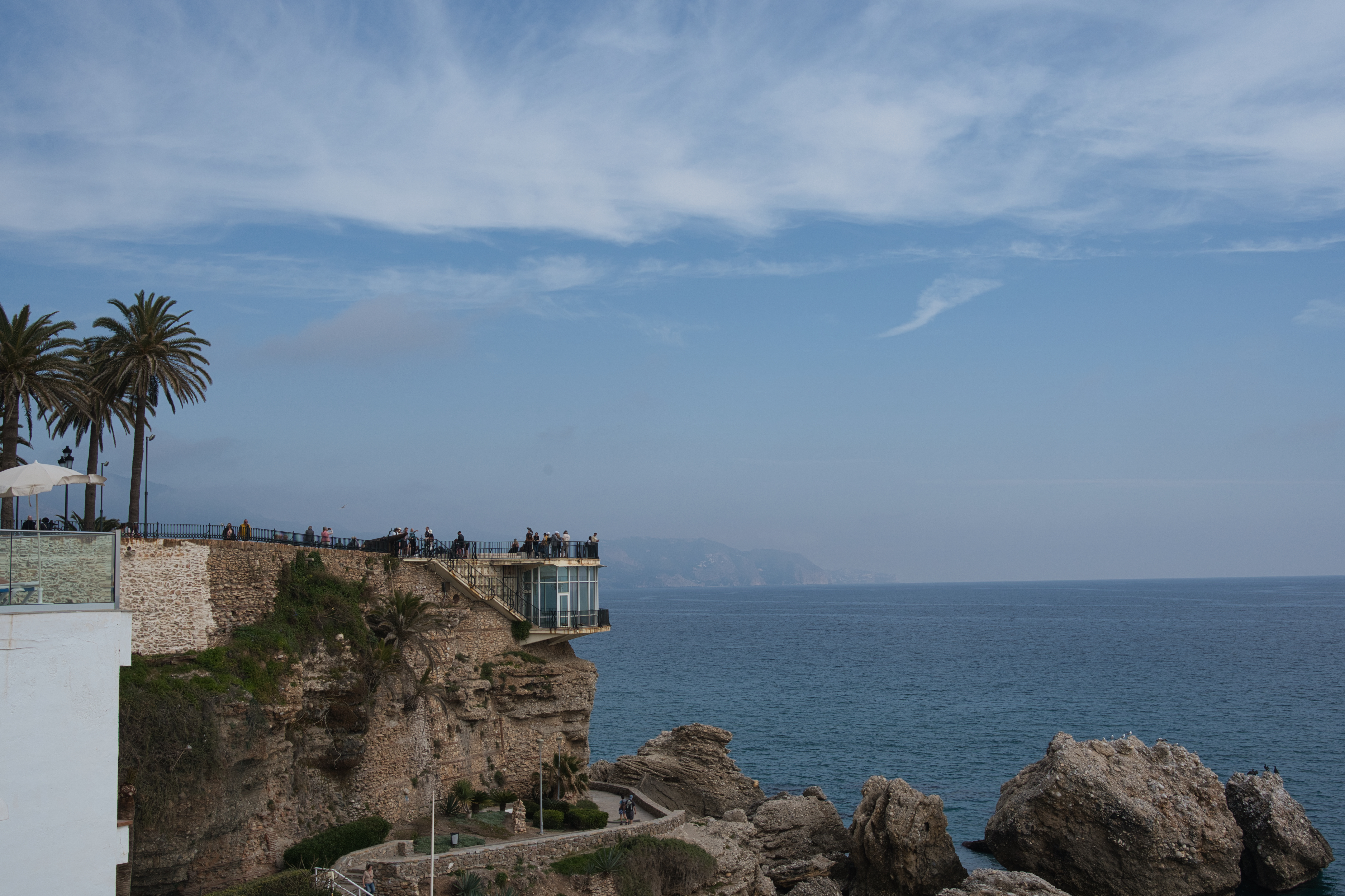 The Balcon de Europa clifftop viewpoint in Nerja, seen from along the coast